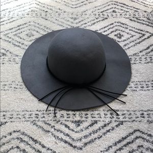 Floppy hat with suede tassel details